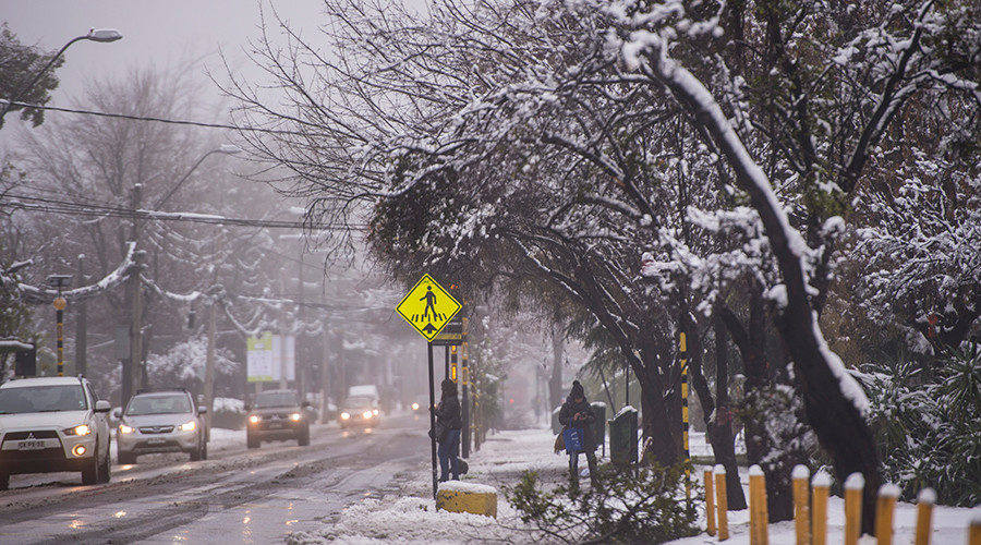 View of a street covered with snow in Santiago on July 15, 2017