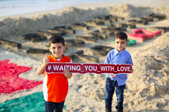 Click to enlarge Palestinian boys await boat to Gaza
