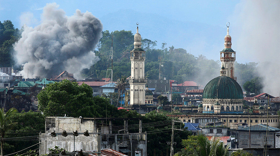 Click to enlarge Smoke is seen following a Philippine Army airstrike