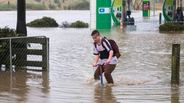 The rain wasn't enough to deter Cameron King from jumping on his scooter.