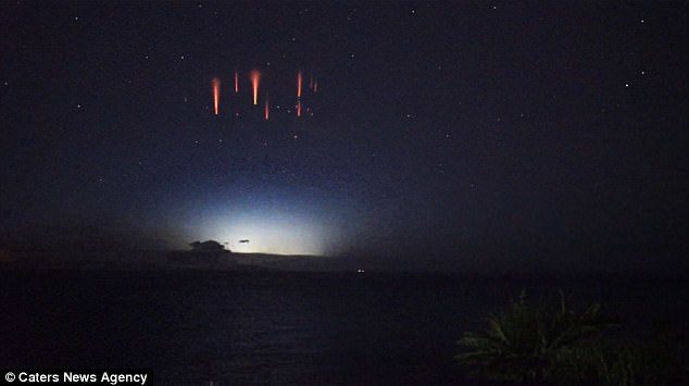 Click to enlarge David Finlay believes he is the first to film one of the only instances of the breathtaking red flashes, known as 'lightning sprites', could be seen from earth in Australia