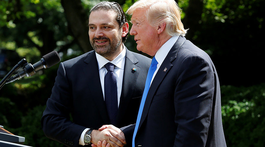 Donald Trump (R) shakes hands with Lebanese Prime Minister Saad Hariri