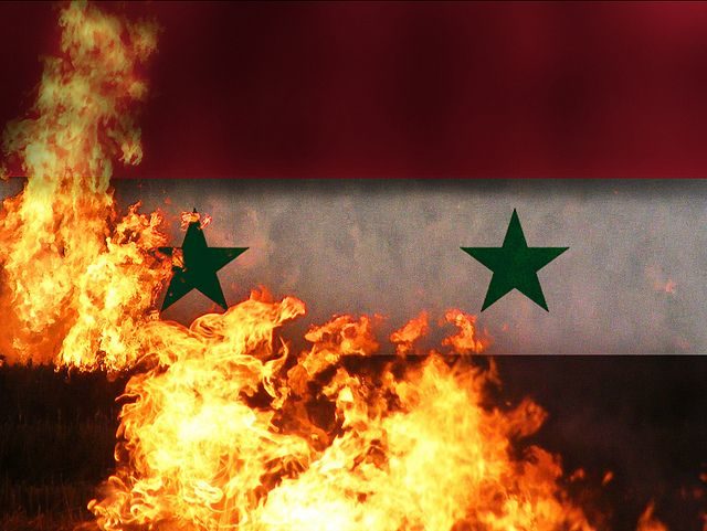 Burning Syria flag