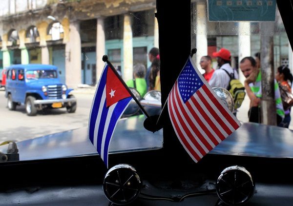 Miniature flags representing Cuba and the United States