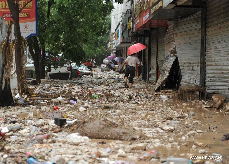 Photo taken on July 27, 2017 shows damaged shops after a flood in Suide county of Yulin city, northwest China's Shaanxi Province.