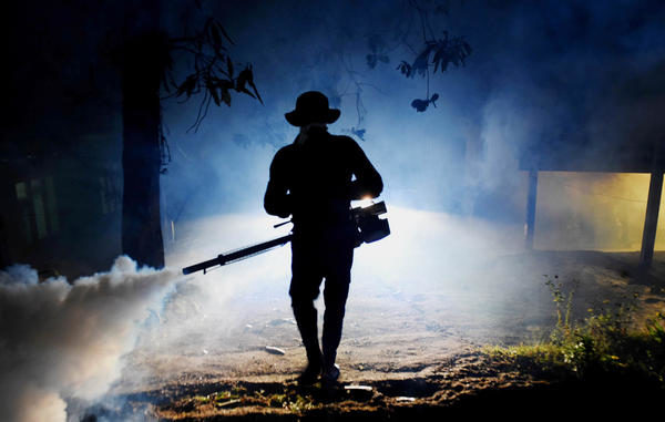 Worker fogging for mosquitos in Sri Lanka