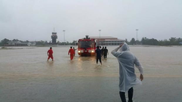 Technicians and experts inspect the flooded Sakon Nakhon airport on Friday for damage to the electric power system and other infrastructure