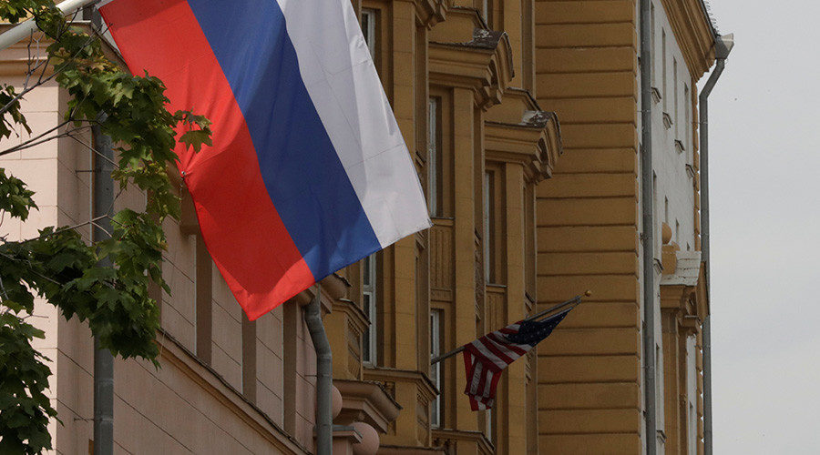 Click to enlarge Russian flag flies in front of the U.S. embassy building in Moscow