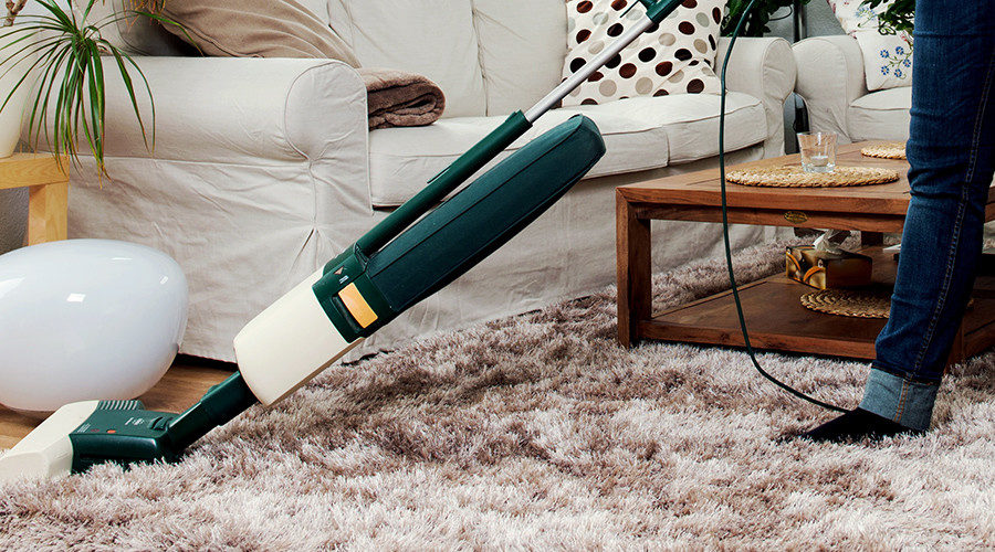 Click to enlarge housekeeper vacuuming
