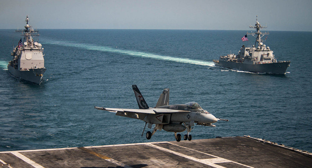 US F/A-18E Super Hornet jet landing on USS Vicent