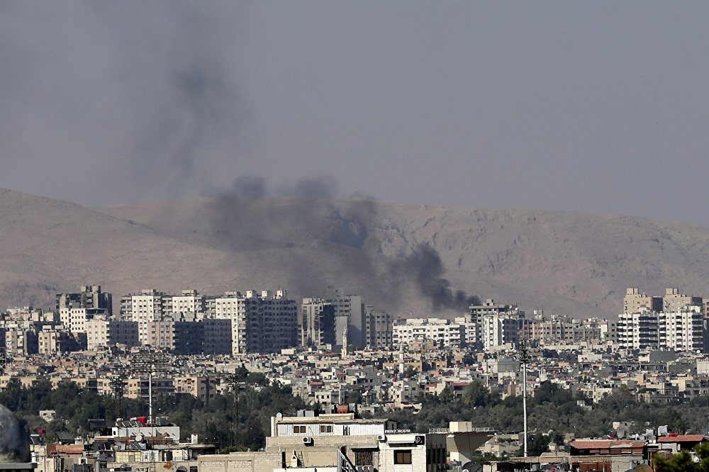 Click to enlarge black columns of smoke from heavy shelling in Barzeh, a suburb of Damascus