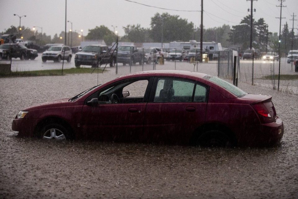 Click to enlarge Drivers brave through -- and some unsuccessfully -- the flooded roadway as heavy rain continues to fall on Wednesday, Aug. 2, 2017 on Hemphill Road between Saginaw Road and Grand Traverse Street at the border of Flint and Burton