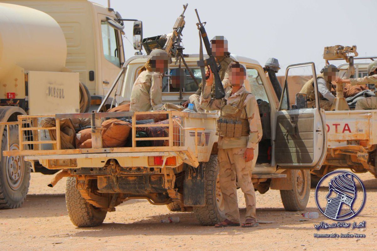 Click to enlarge US and rebel Syrian soldiers