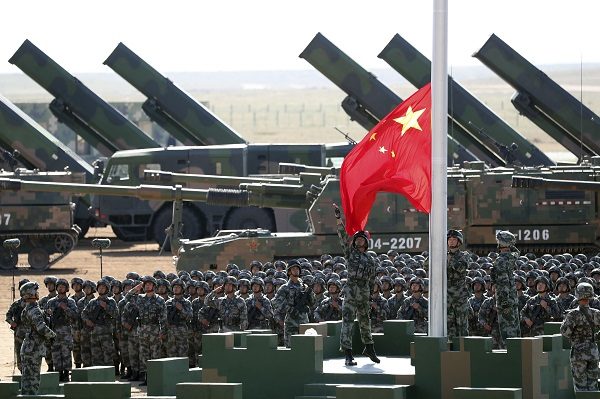 Click to enlarge Chinese People's Liberation Army (PLA) troops perform a flag raising ceremony