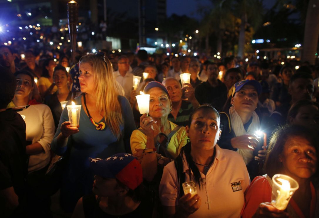 Venezuela Demonstrators hold candles during a vigil