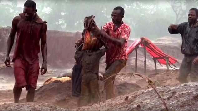 Click to enlarge child in Congo carries rocks