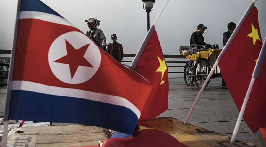 Click to enlarge N. Korea and China flags