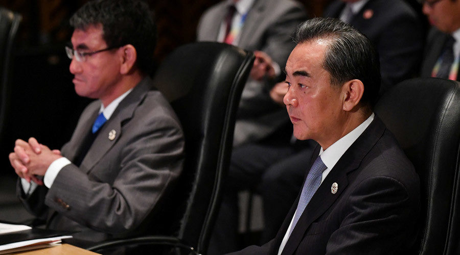 Click to enlarge China's Foreign Minister Wang Yi and Japan's Foreign Minister Taro Kono