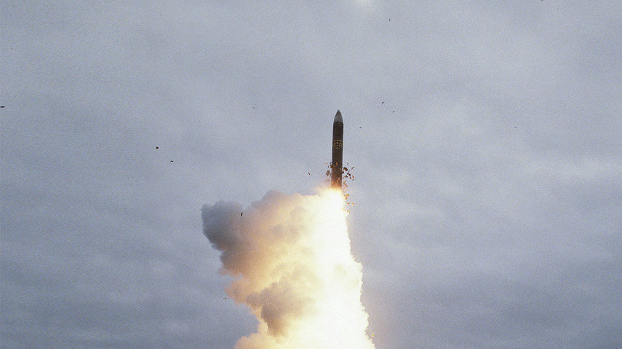 An MX intercontinental ballistic missile fills the air with flames during a test launch