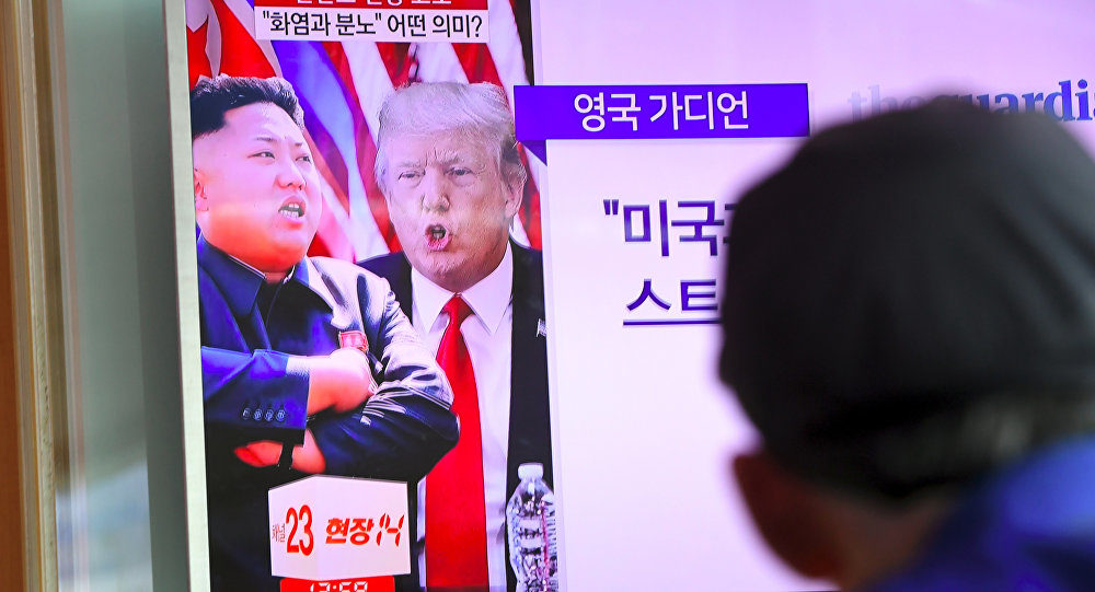 korea tv screen with Kim Jung-un and Donald Trump