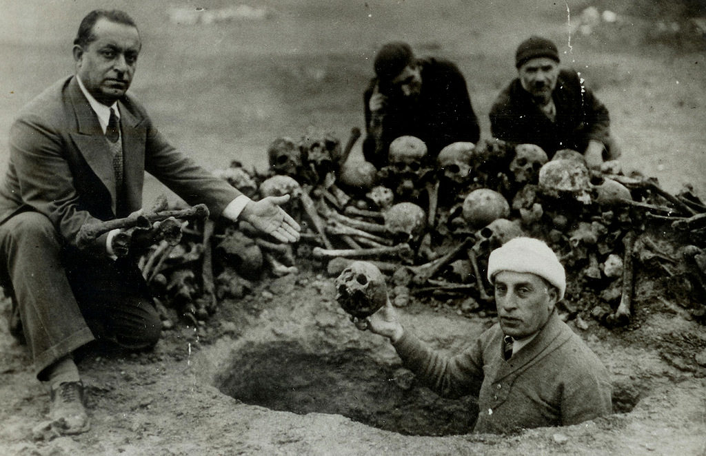 A group of men excavate the remains of victims of the Armenian genocide in modern day, Deir ez-Zor, Syria, 1938