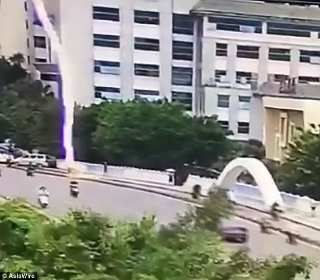 Video footage shows the moment the lightning hits the scooter rider in Guangxi province