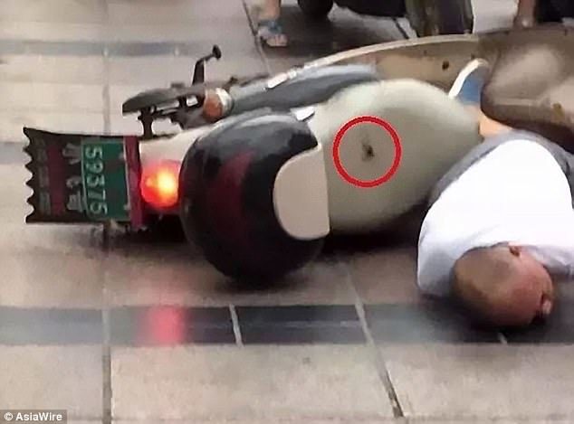 A hole can be seen on the man's bike, left by the powerful lightning strike