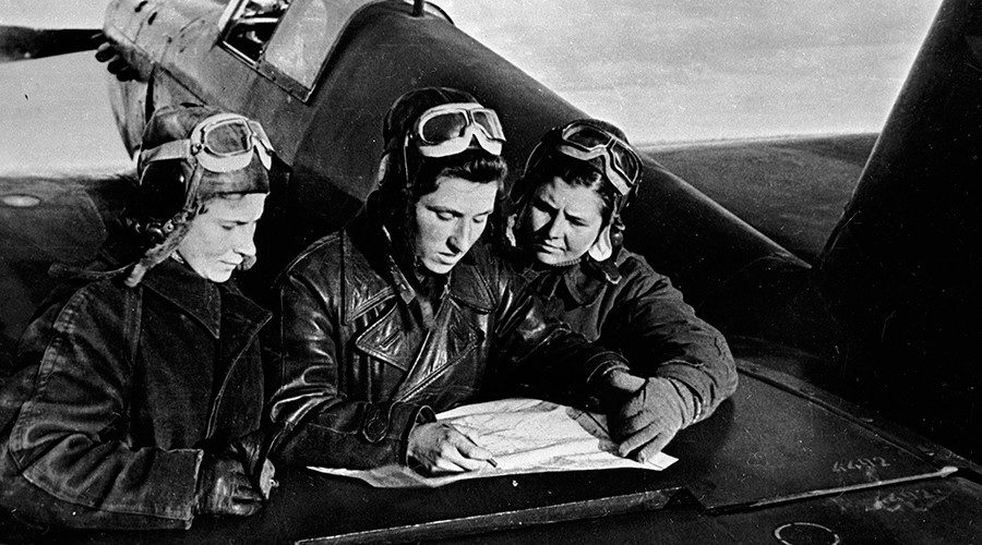 Female pilots of the 586th regiment: Litvyak, Budanova and Kuznetsova (left to right) near the YaK-1 aircraft