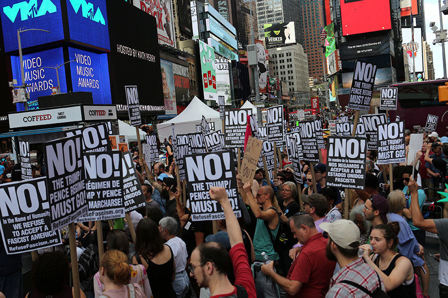 Protesters chant slogans against white nationalism in Times Square in New York City