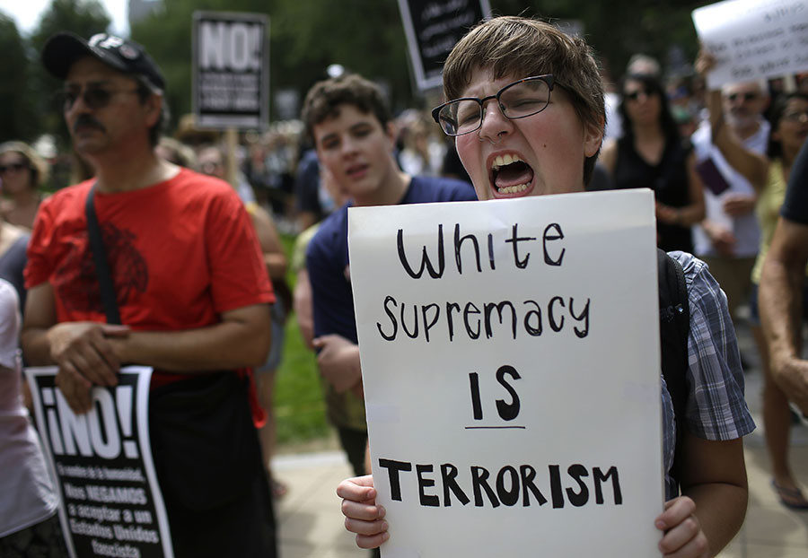 Demonstrators protest against hate, white supremacy groups and US President Donald Trump in Chicago, Illinois.