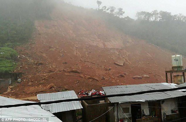 At least 300 have been killed after a mudslide (pictured) sparked by heavy rain crashed through part of Sierra Leone's capital