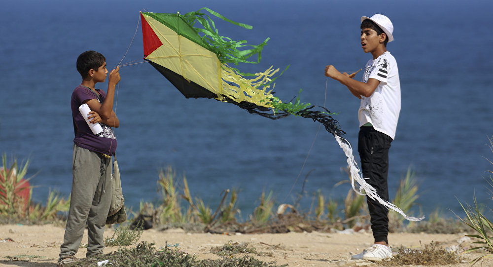 Palestinian youths flying a kite
