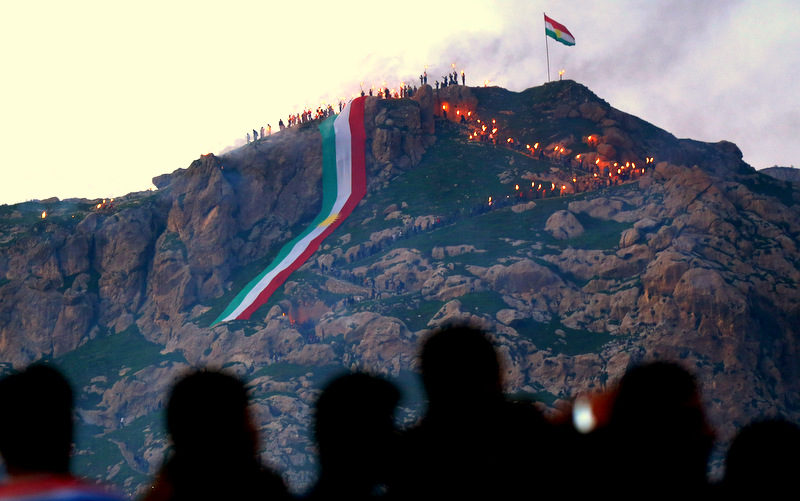 Iraqi Kurds unfurl a giant Kurdish flag