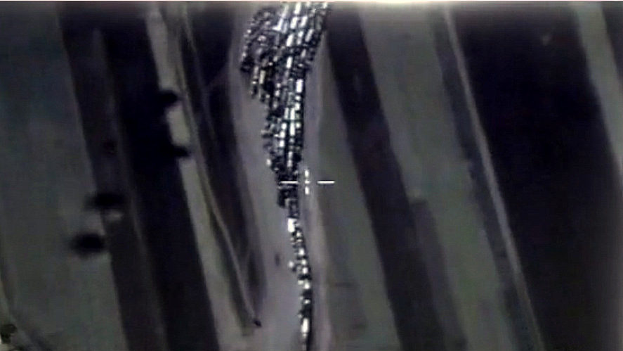 A photograph released by Russian intelligence depicting thousands of trucks laden with oil crossing from Syria into Turkey