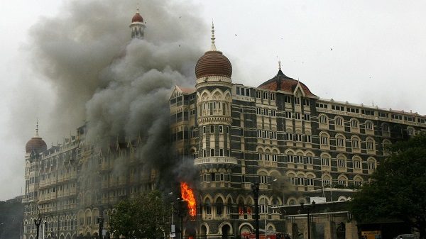 The Taj Mahal Palace Hotel is seen engulfed in smoke during the 2008 Mumbai terror attacks
