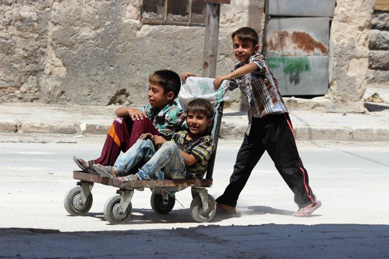 syrian children return Aleppo
