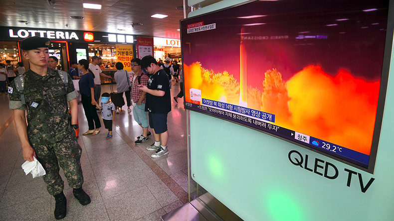 South Korean soldier watches a video footage of North Korea's launch