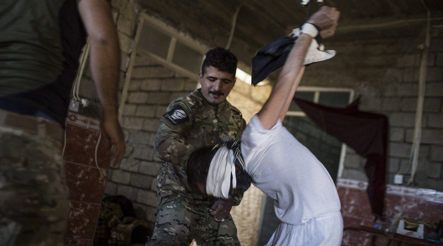 Iraqi soldier torturing captive