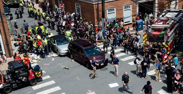 People receive first-aid after a car accident ran into a crowd of protesters in Charlottesville