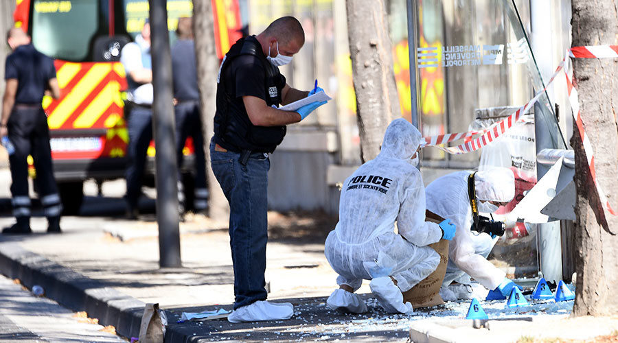 French forensic police search the site following a car crash on August 21, 2017, in the southern Mediterranean city of Marseille