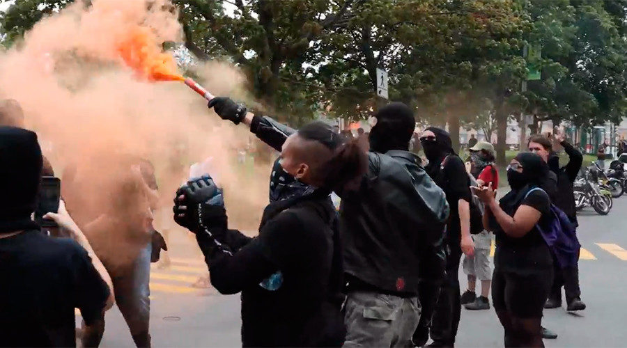 Anti-fascist protesters against an anti-illegal immigration rally