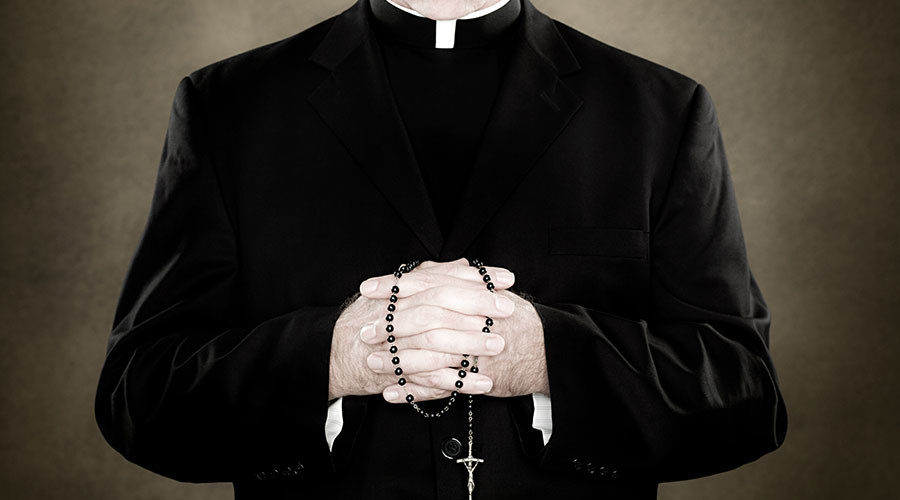 Click to enlarge Catholic priest