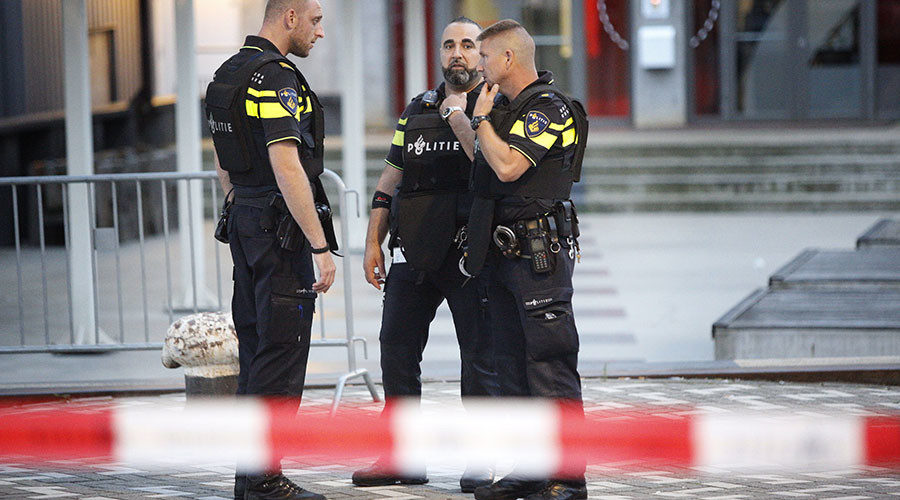 Police stand during the evacuation the Maassilo concert venue