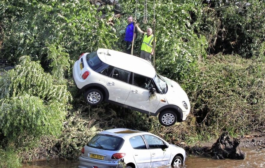 Cars were swept into the River Faughan at Drumahoe on the outskirts of Derry during severe rain and storms in the north west.