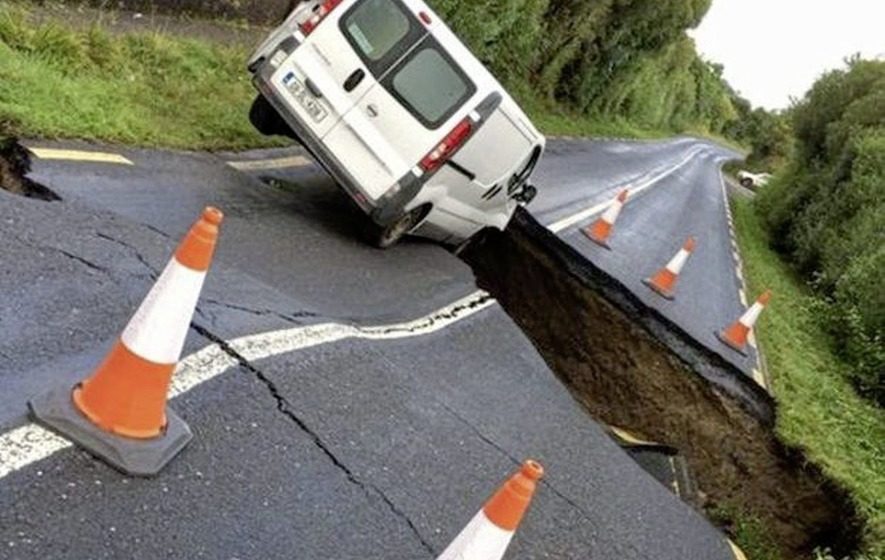 The driver of a van in Inishowen had a lucky escape when floods opened a huge hole in the road.