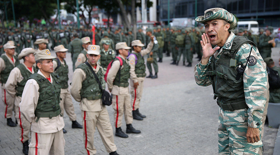 Click to enlarge Members of the National Bolivarian Militia get ready before a military exercise in Caracas