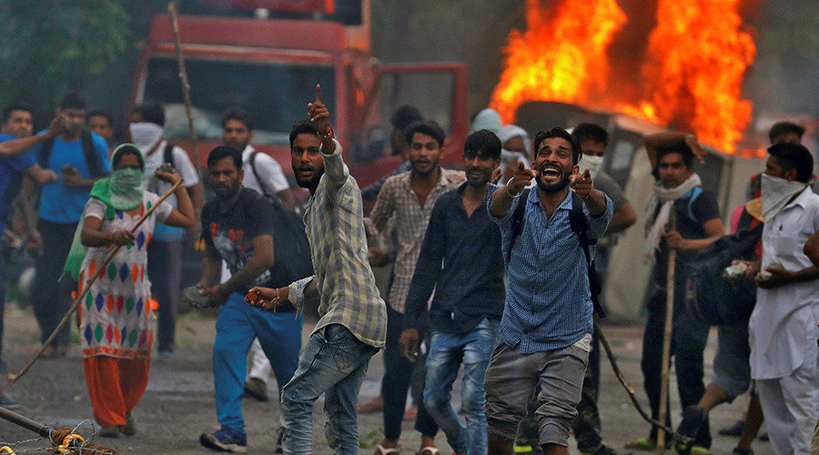 People react during violence in Panchkula, India