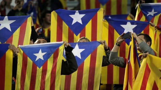 Barcelona supporters wave Estelada or pro-independece flags