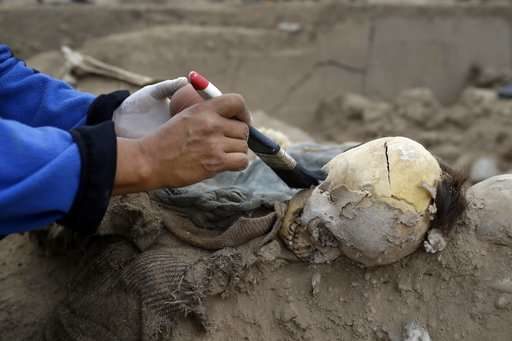 Click to enlarge Archeologists work at the site where 16 tombs belonging to 19th century Chinese immigrants were discovered
