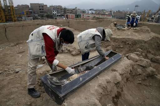 Click to enlarge Archeologists work at the site where 16 tombs belonging to 19th century Chinese immigrants were discovered